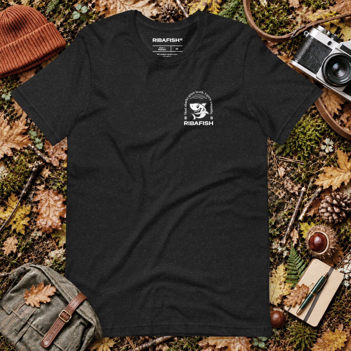 Most sharks grow teeth. I grew empathy. / Unisex t-shirt / Black Heather